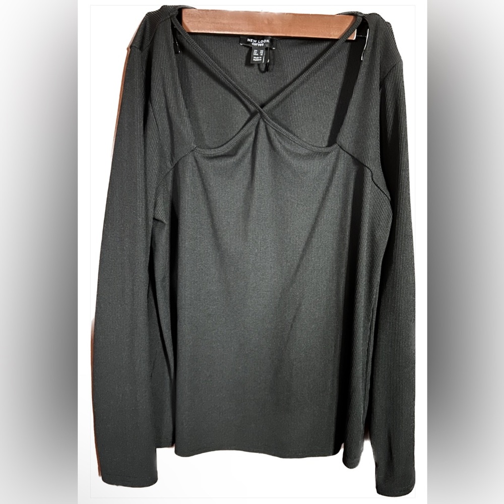 Black long sleeve top with cross ties across chest